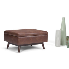 Owen 34 inch Wide Coffee Table Storage Ottoman in Distressed Saddle Brown Vegan Leather