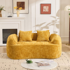 Yellow curved two - person compress sofa. It has armrests on both sides, comes with two pillows, is suitable for small - sized apartments, and can be placed in the living room or bedroom.