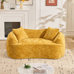 Yellow curved two - person compress sofa. It has armrests on both sides, comes with two pillows, is suitable for small - sized apartments, and can be placed in the living room or bedroom.