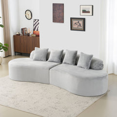 Modern and simple curved flannelette sofa. Creative multi-seater in light gray for the living room, with a combination of pillows.