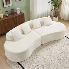 white curved multi - seater sofa. The plush and skin - friendly fabric makes it an excellent choice for modern living room settings.