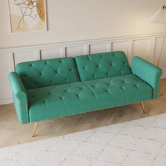 A 69.7-inch-long sofa bed covered in green velvet fabric, featuring nail head trim and accompanied by a matching throw pillow