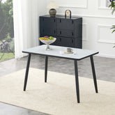 Modern minimalist rectangular dining table, suitable for 4-6 people. Tempered glass countertop+lower MDF board, imitation marble texture, black metal tapered legs. Suitable for minimalist restaurants.