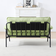 The 53-inch green sofa offers a spacious layout in the small apartment, easily handling various scenarios from watching movies to working