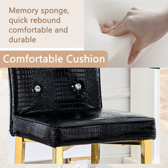 A set of 2 black and gold vintage crocodile leather bar chairs, featuring crystal clasp design and synthetic leather design, adding a touch of elegance and mystery to the dining area