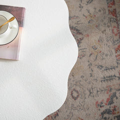 Scalloped White Coffee Table: Unique Wave-Edge Shape, Elegant Focal Piece for Stylish Spaces.