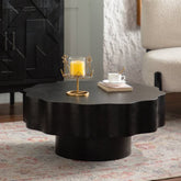 Scalloped Black Coffee Table: Unique Wave-Edge Shape, Elegant Focal Piece for Stylish Spaces.