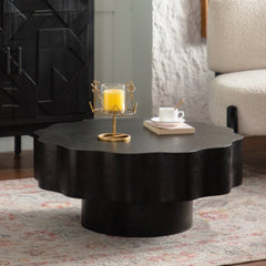 Scalloped Black Coffee Table: Unique Wave-Edge Shape, Elegant Focal Piece for Stylish Spaces.