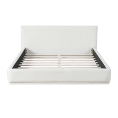 Soft and comfortable upholstered bed. Luxurious and cozy bedroom centerpiece, queen size, white