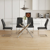 Table and chair set.Modern Luxurious Transparent Tempered Glass Dining Table Set with 4 Chairs.Single Fork Silver Metal Table Legs.Black high-quality PU dining chairs with silver metal legs.