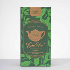 Tea box with green leaves and a teapot design on a white background