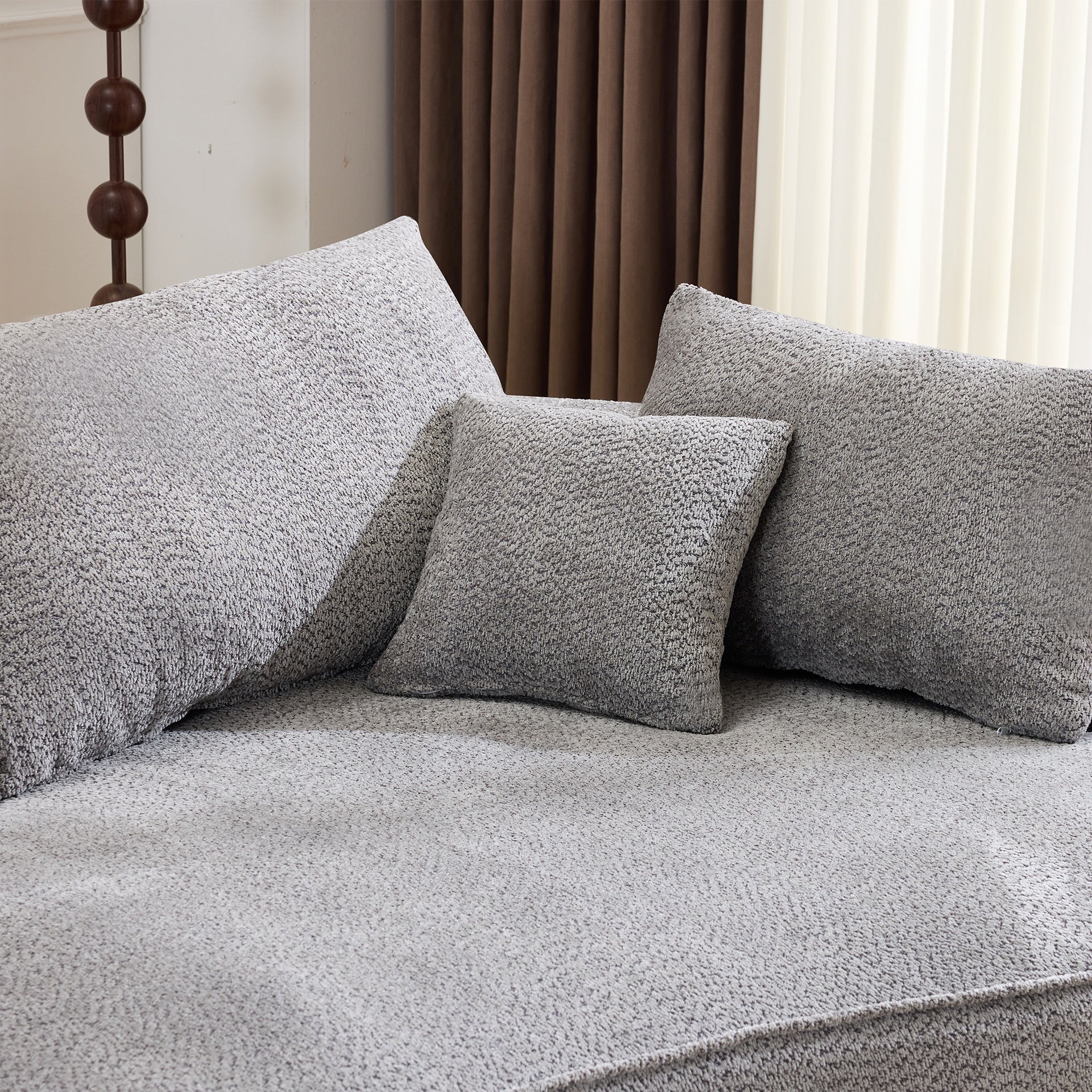 124.5-inch modern compressed boneless sofa, made of grey chenille fabric, comes with 3 back pillows and 4 throw pillows. The high-resilience sponge provides a comfortable  experience.No assembly