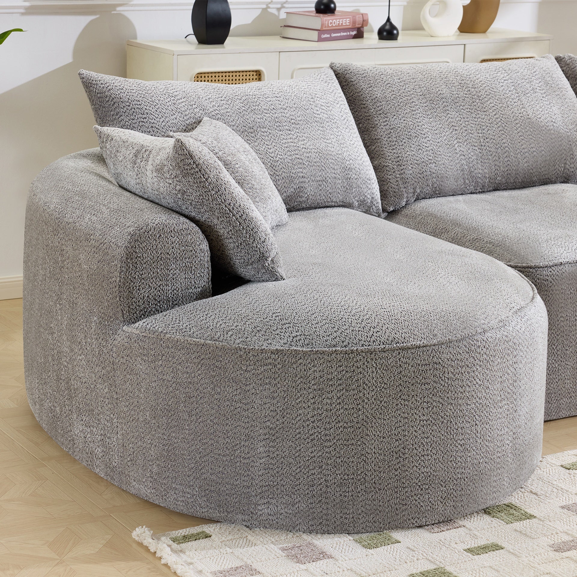 124.5-inch modern compressed boneless sofa, made of grey chenille fabric, comes with 3 back pillows and 4 throw pillows. The high-resilience sponge provides a comfortable  experience.No assembly