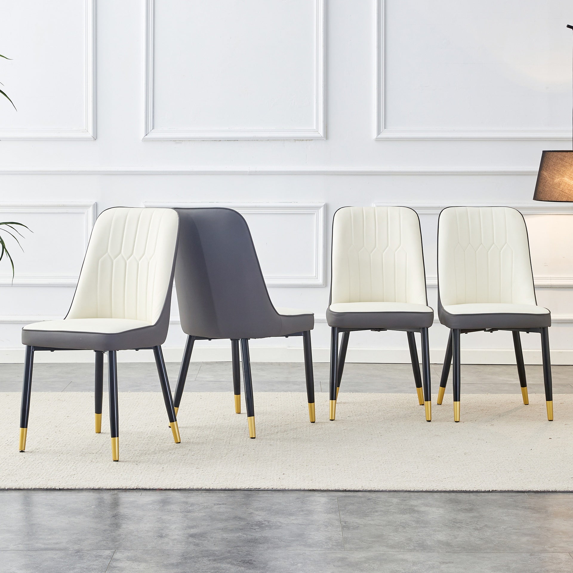 A modern dining chair with a white dark gray dual tone PU leather backrest and black metal legs, suitable for kitchens, bedrooms, and offices. A set of 4 pieces (white+dark gray+PU)C-007 W1151118960