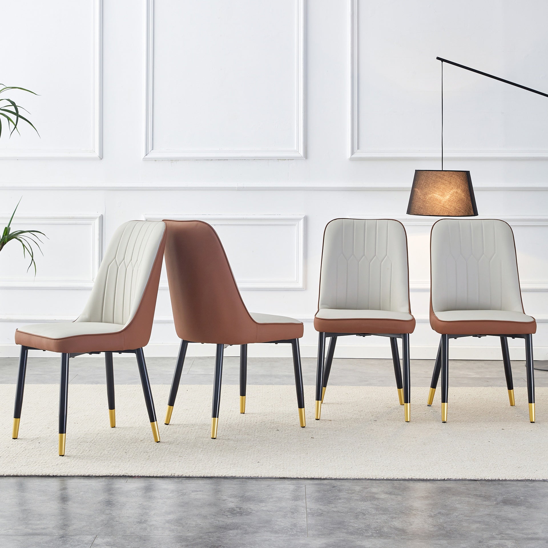 A modern dining chair with a light gray brown dual tone PU leather backrest and black metal legs, suitable for kitchens, bedrooms, and offices. Set of 4 pieces (light gray+brown+PU)C-007  W1151118958