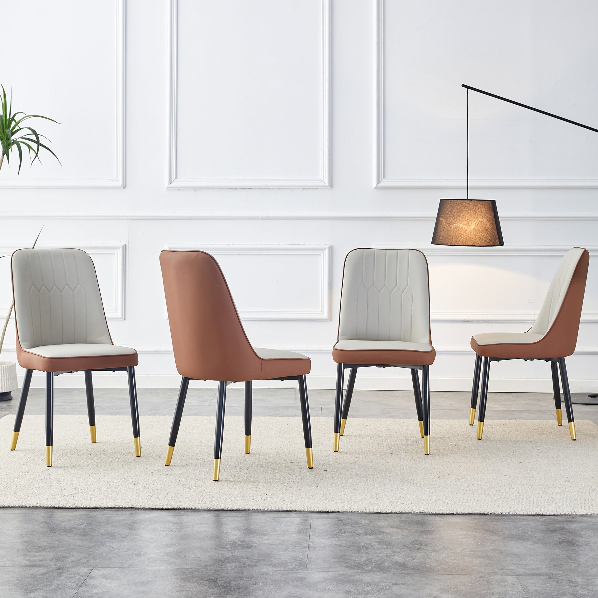 A modern dining chair with a light gray brown dual tone PU leather backrest and black metal legs, suitable for kitchens, bedrooms, and offices. Set of 4 pieces (light gray+brown+PU)C-007  W1151118958