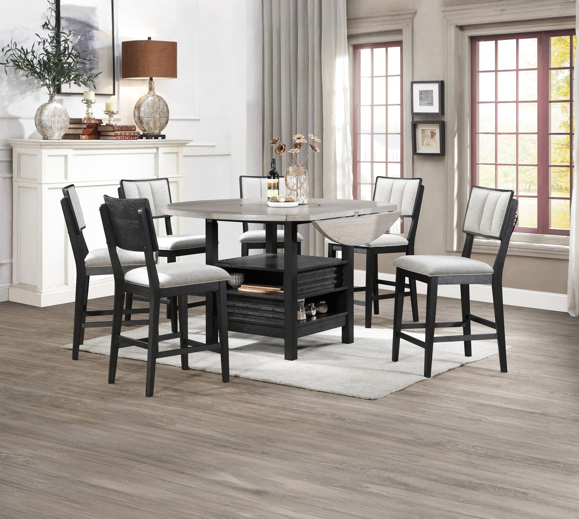 7pc Farmhouse Contemporary Counter Height Dining Set Storage Table Single Pedestal Round Black Gray Natural Grain Integrated Turntable Drop Leaves Built-in Shelving Fabric Upholstery Chairs