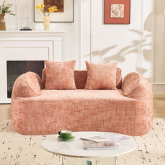 Pink curved two - person compress sofa. It has armrests on both sides, comes with two pillows, is suitable for small - sized apartments, and can be placed in the living room or bedroom.