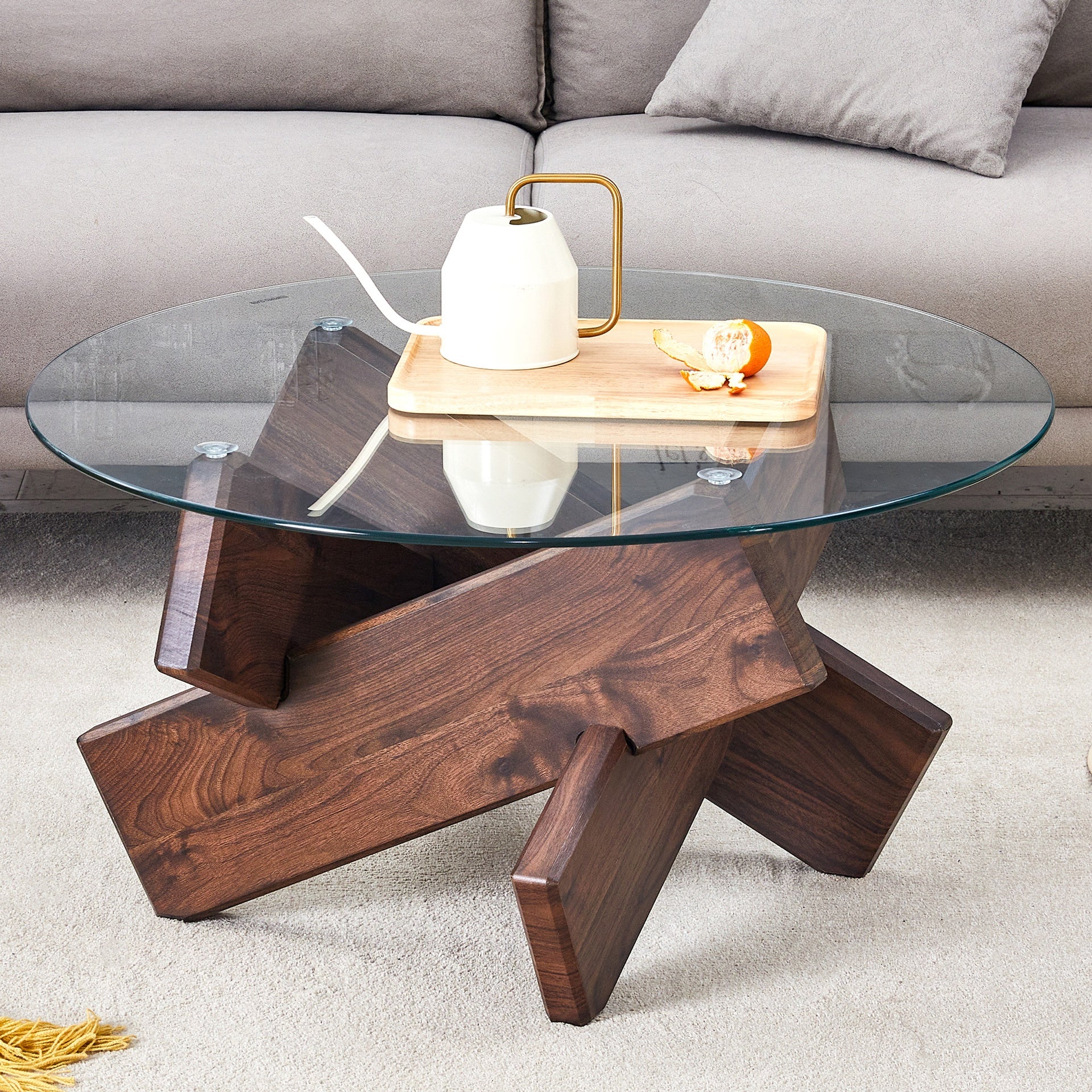 Round glass coffee table, 33.4" modern design unique coffee table. Tempered glass top with Walnut colored texture sticker MDF legs. Suitable for living and dining rooms