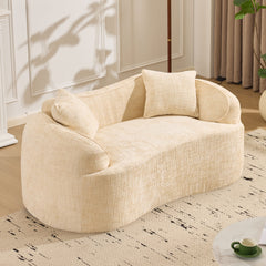Beige curved two - person compress sofa. It has armrests on both sides, comes with two pillows, is suitable for small - sized apartments, and can be placed in the living room or bedroom.