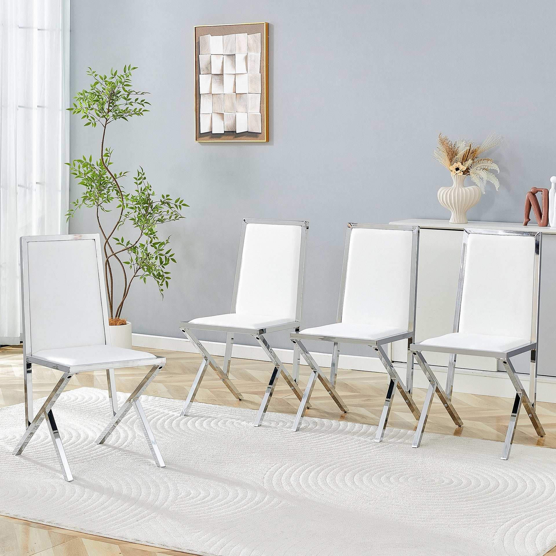4-pack silver metal framed white PU dining chairs: ergonomic design, a simple and luxurious choice.Featuring uniquely designed silver metal legs.