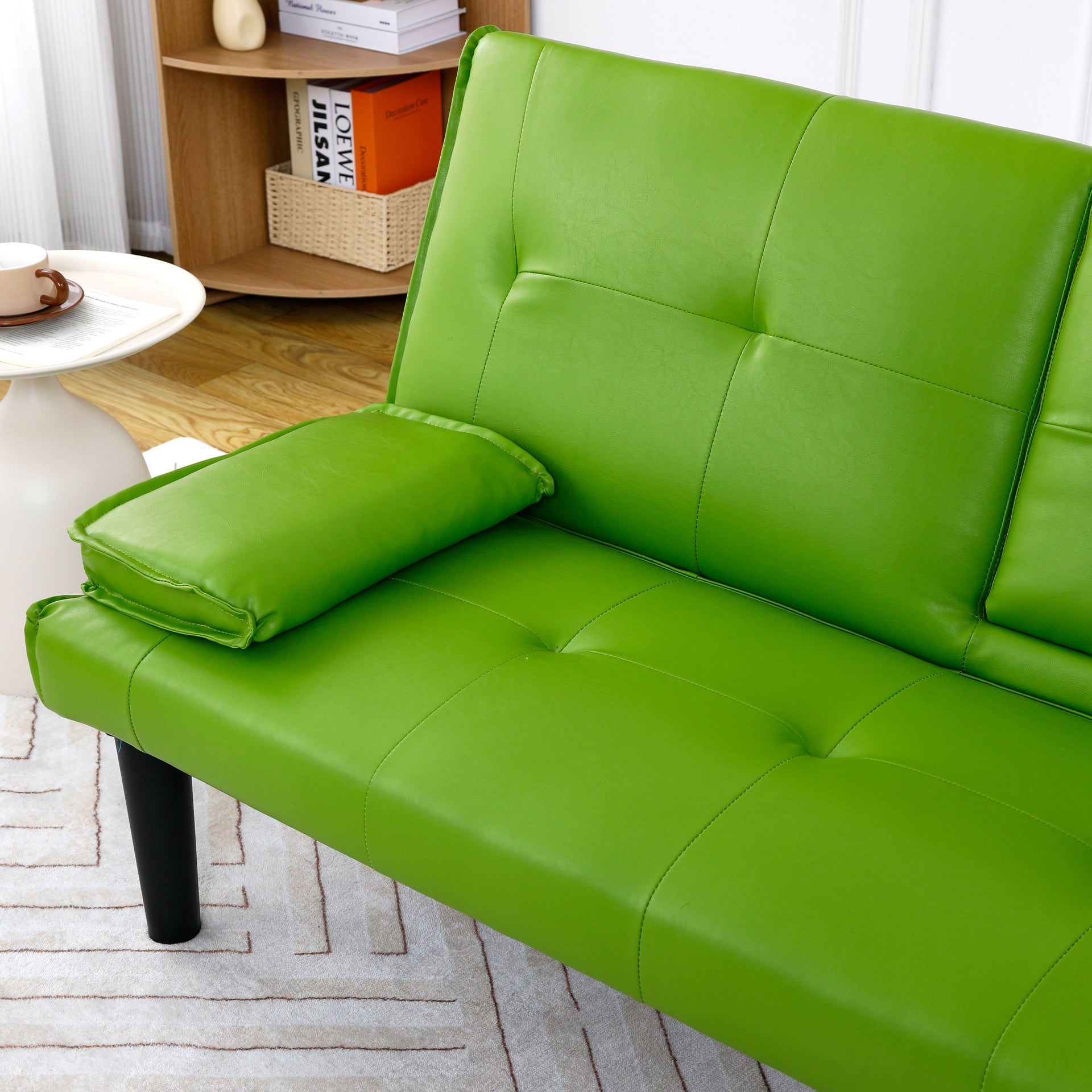 The 67-inch green PVC multi-functional sofa bed, with a foldable and cup holder design, makes it extremely convenient to turn the living room into a guest room