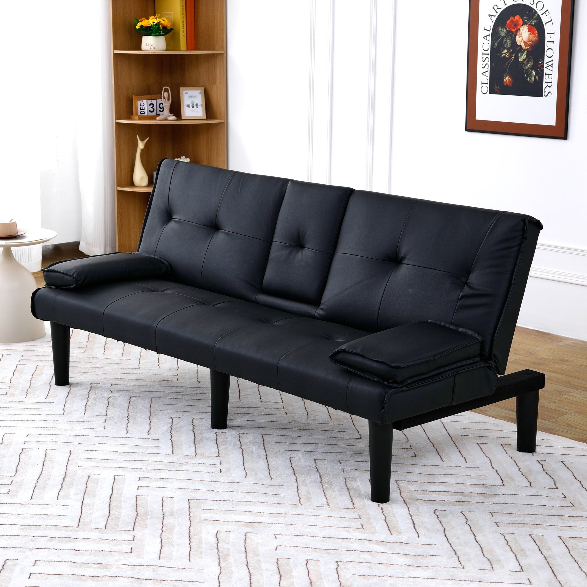 The 67-inch black PVC multi-functional sofa bed with a foldable and cup holder design makes it extremely convenient to turn the living room into a guest room
