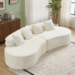 white curved multi - seater sofa. The plush and skin - friendly fabric makes it an excellent choice for modern living room settings.