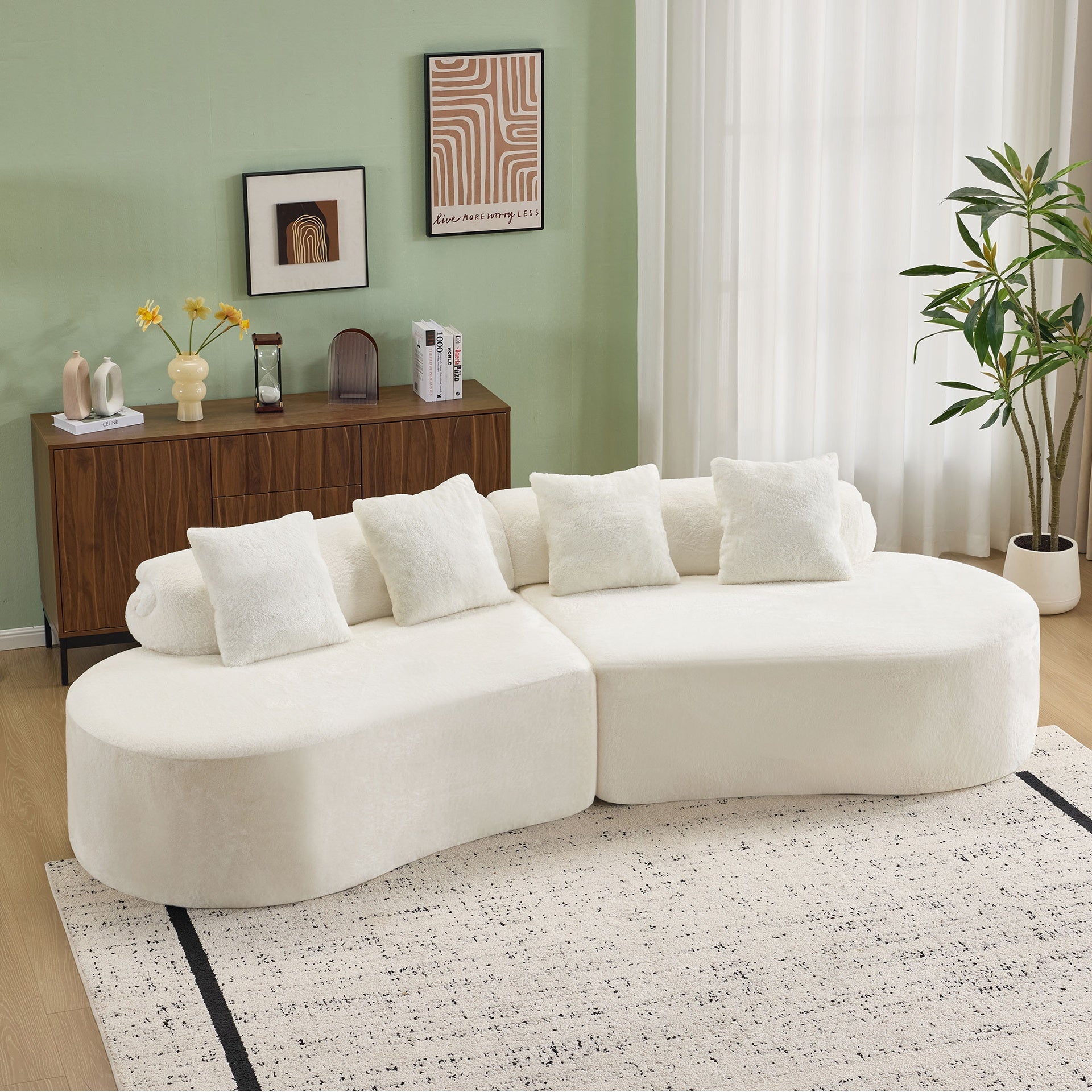 white curved multi - seater sofa. The plush and skin - friendly fabric makes it an excellent choice for modern living room settings.