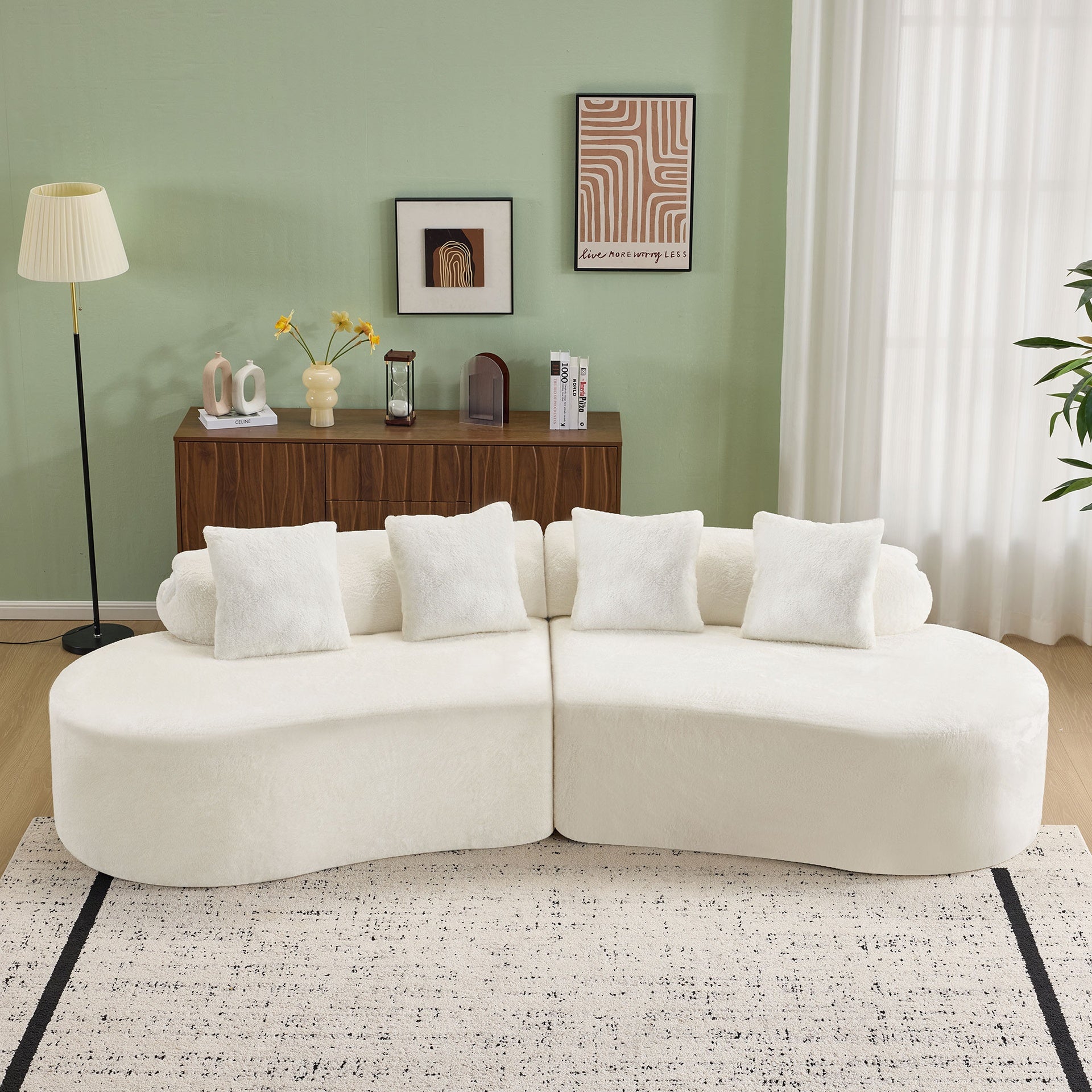 white curved multi - seater sofa. The plush and skin - friendly fabric makes it an excellent choice for modern living room settings.