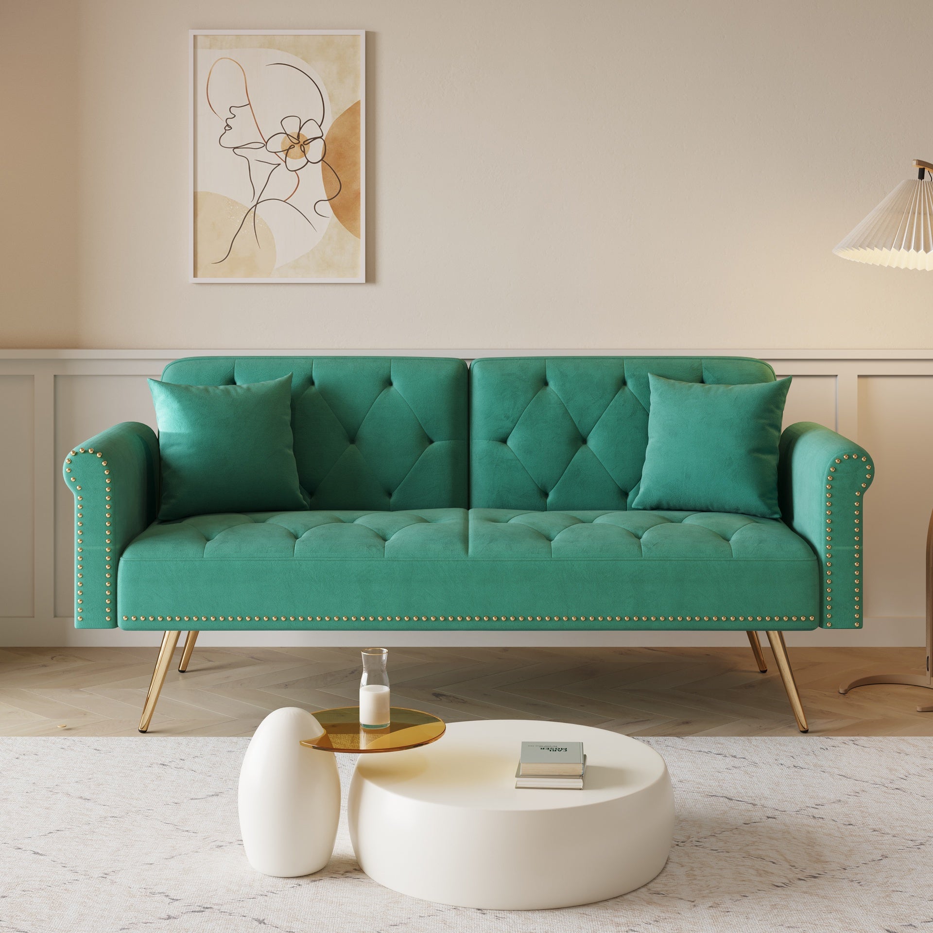 A 69.7-inch-long sofa bed covered in green velvet fabric, featuring nail head trim and accompanied by a matching throw pillow