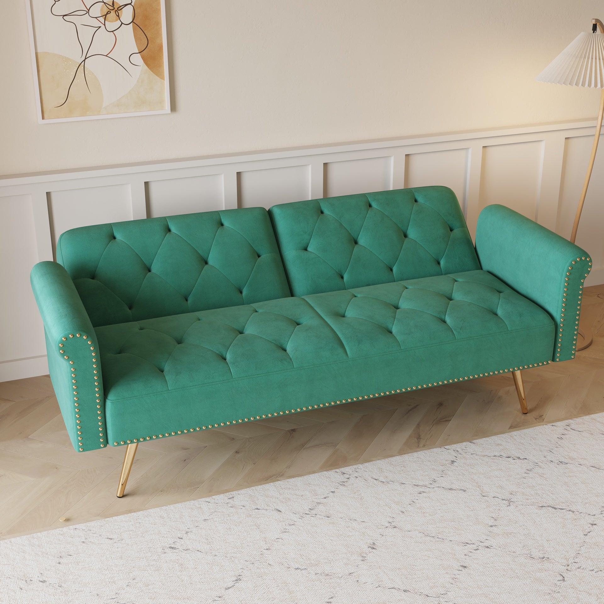 A 69.7-inch-long sofa bed covered in green velvet fabric, featuring nail head trim and accompanied by a matching throw pillow