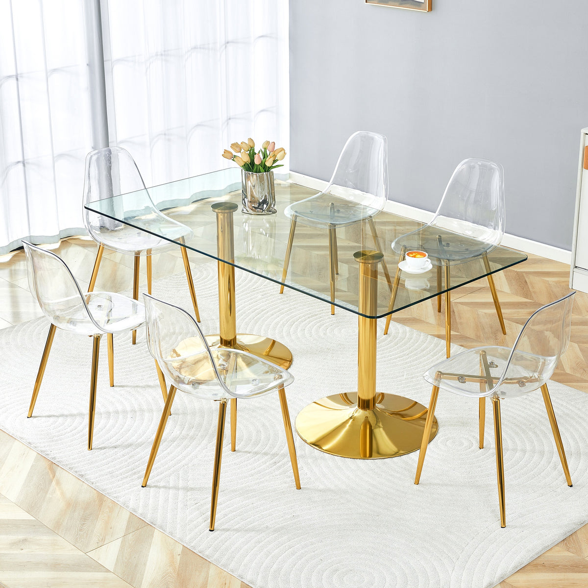 Table and chair set.71 inch x 35.4-inch tempered glass table,Paired with 6 Transparent Plastic Chairs with Golden Metal Legs.Bring a comfortable home experience.