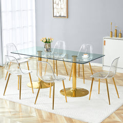 Table and chair set.71 inch x 35.4-inch tempered glass table,Paired with 6 Transparent Plastic Chairs with Golden Metal Legs.Bring a comfortable home experience.