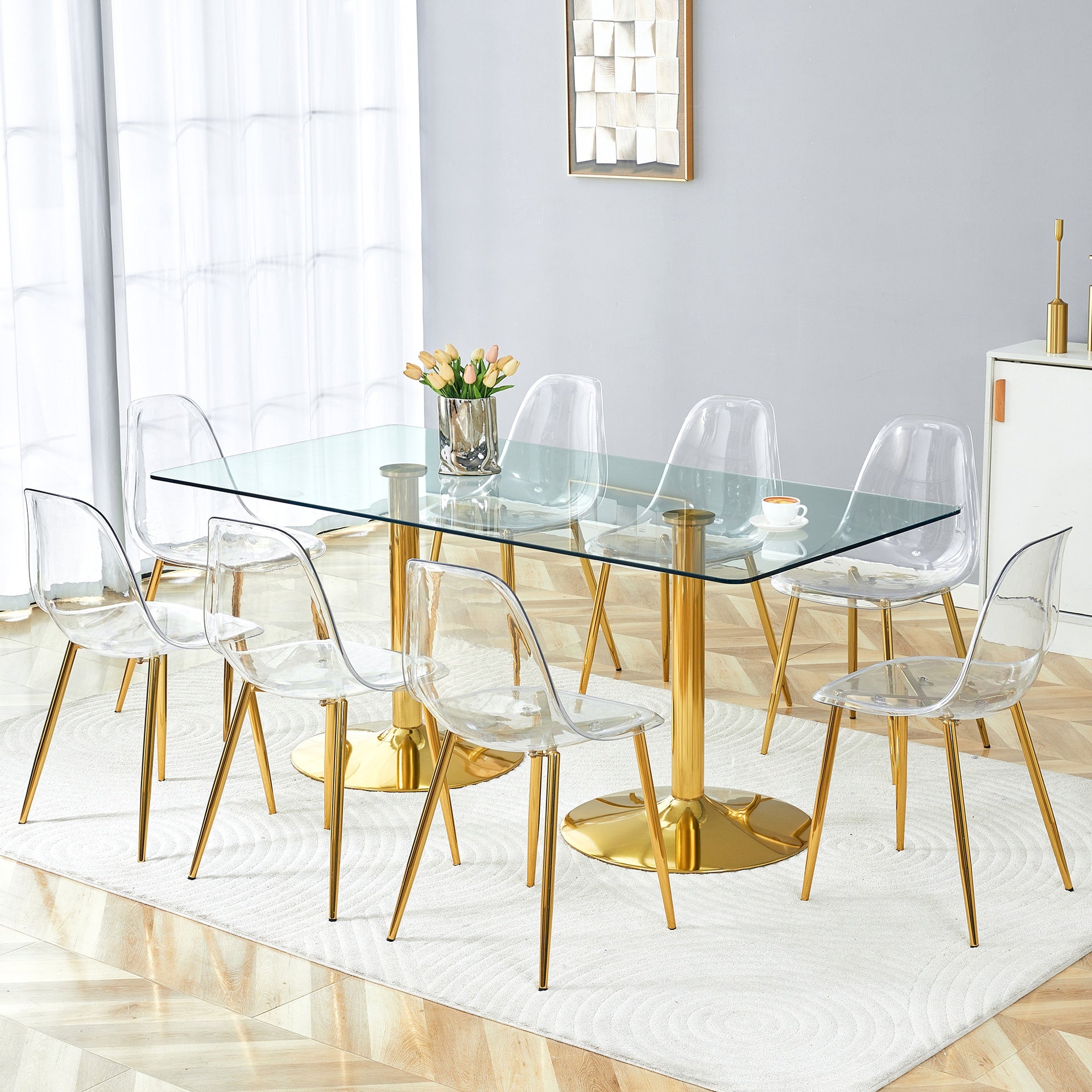 Table and chair set.71 inch x 35.4-inch tempered glass table,Paired with 8 Transparent Plastic Chairs with Golden Metal Legs.Bring a comfortable home experience.
