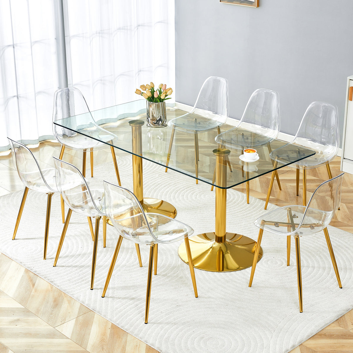 Table and chair set.71 inch x 35.4-inch tempered glass table,Paired with 8 Transparent Plastic Chairs with Golden Metal Legs.Bring a comfortable home experience.