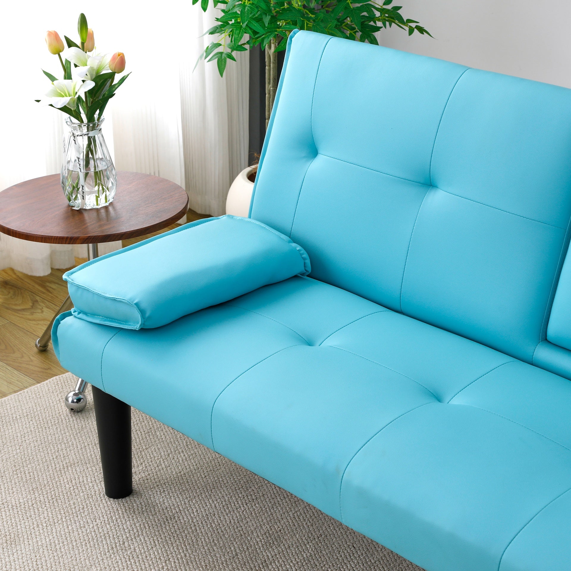 The 67-inch blue PVC multi-functional sofa bed, with a foldable and cup holder design, makes it extremely convenient to turn the living room into a guest room