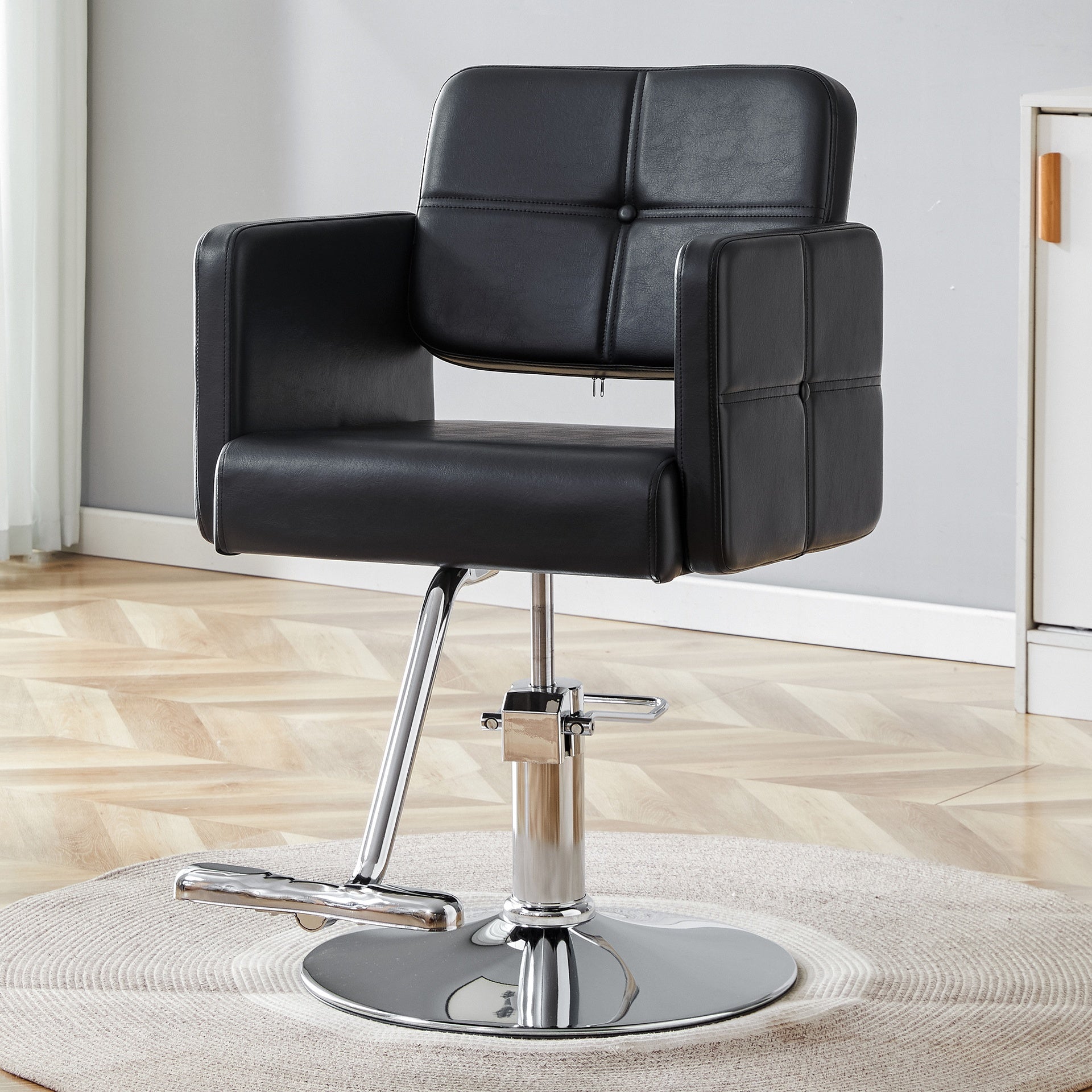Fashionable black salon style chair with silver metal support legs - ideal for hair salons and beauty salons, adjustable and rotatable, with a single chair inside the link.