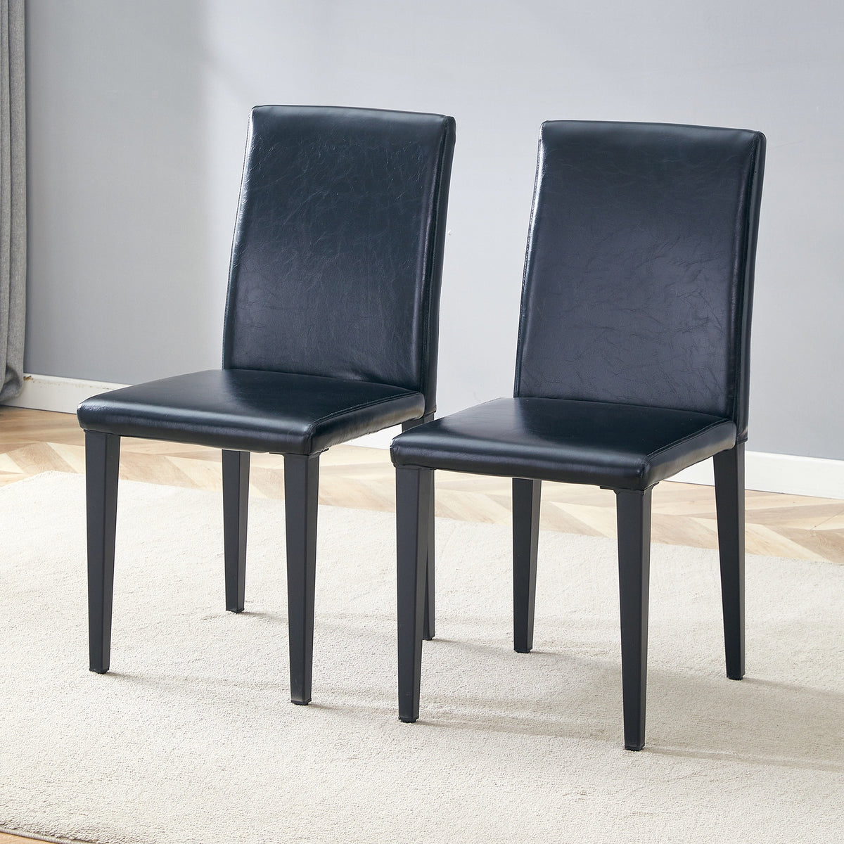 Two black PU dining chairs, simple and versatile, comfortable and accompanied. The exquisite and multifunctional dining chair has opened up a comfortable new experience. (2-piece set)W1151P263129