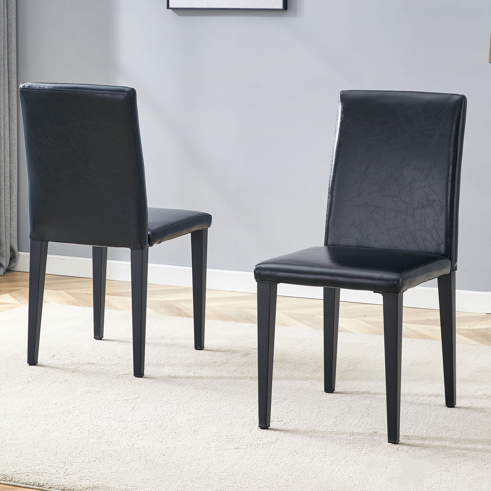 Two black PU dining chairs, simple and versatile, comfortable and accompanied. The exquisite and multifunctional dining chair has opened up a comfortable new experience. (2-piece set)W1151P263129