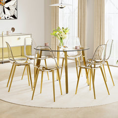 Table and chair set.Modern circular transparent tempered glass table, tempered glass tabletop, golden metal table legs.A Set of  6 Transparent Plastic Chairs with gold legs.