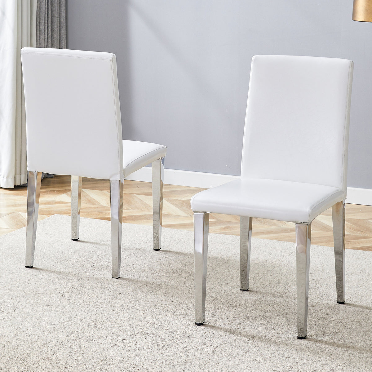 Two White PU dining chairs,Silver Metal Legs.Simple and versatile, comfortable and accompanied. Exquisite and versatile dining chairs unlock a comfortable new experience.(Set of 2)W1151P269051