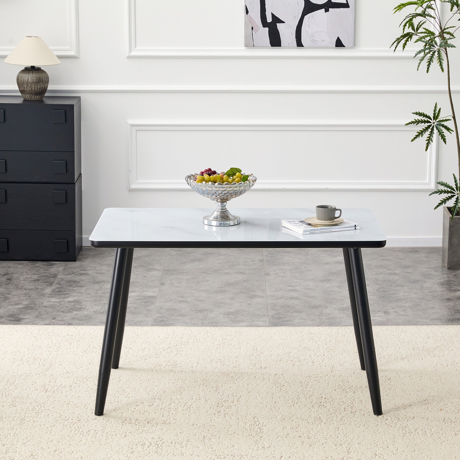 Modern minimalist rectangular dining table, suitable for 4-6 people. Tempered glass countertop+lower MDF board, imitation marble texture, black metal tapered legs. Suitable for minimalist restaurants.