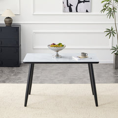 Modern minimalist rectangular dining table, suitable for 4-6 people. Tempered glass countertop+lower MDF board, imitation marble texture, black metal tapered legs. Suitable for minimalist restaurants.