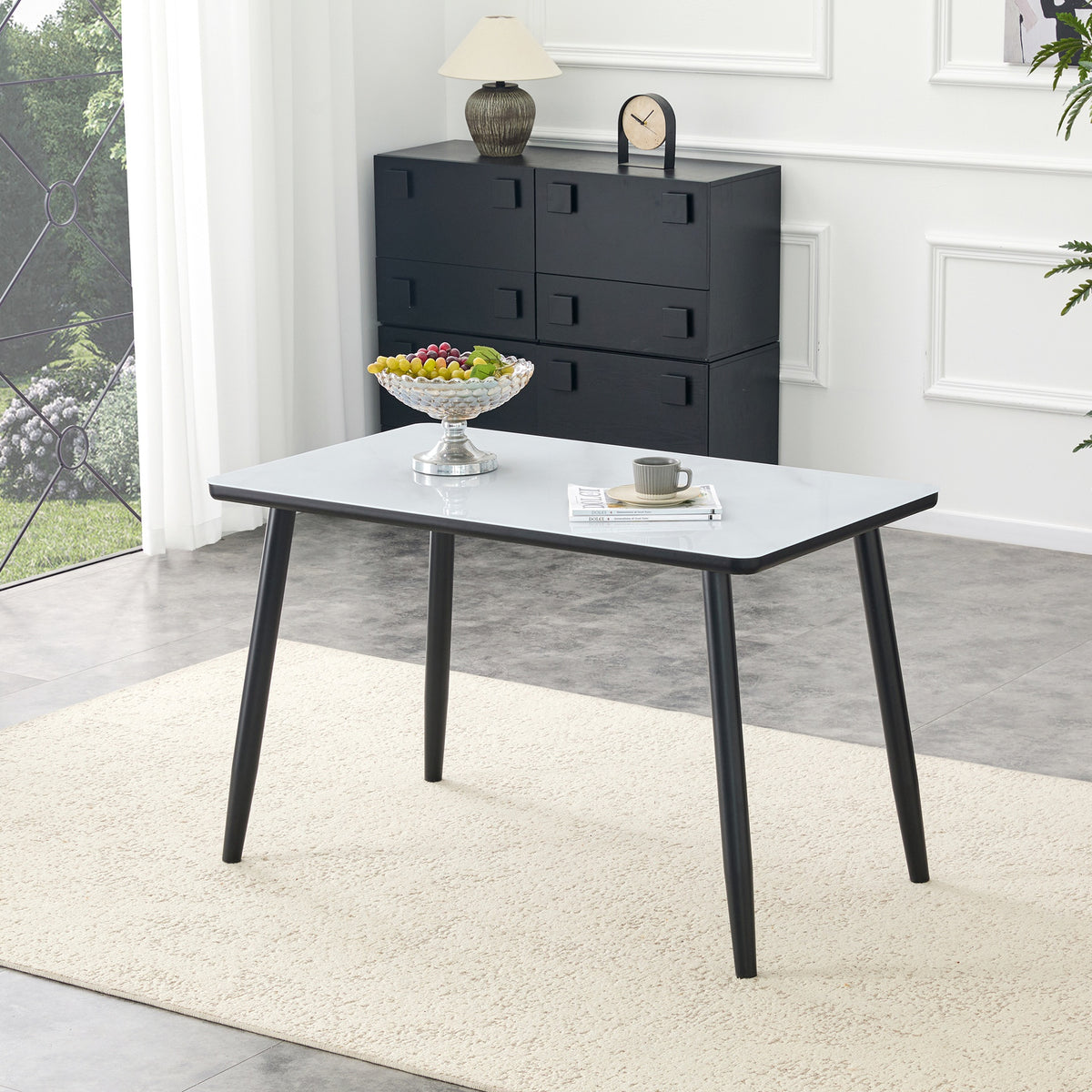 Modern minimalist rectangular dining table, suitable for 4-6 people. Tempered glass countertop+lower MDF board, imitation marble texture, black metal tapered legs. Suitable for minimalist restaurants.