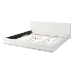 Soft and comfortable upholstered bed. Luxurious and cozy bedroom centerpiece, king size, white