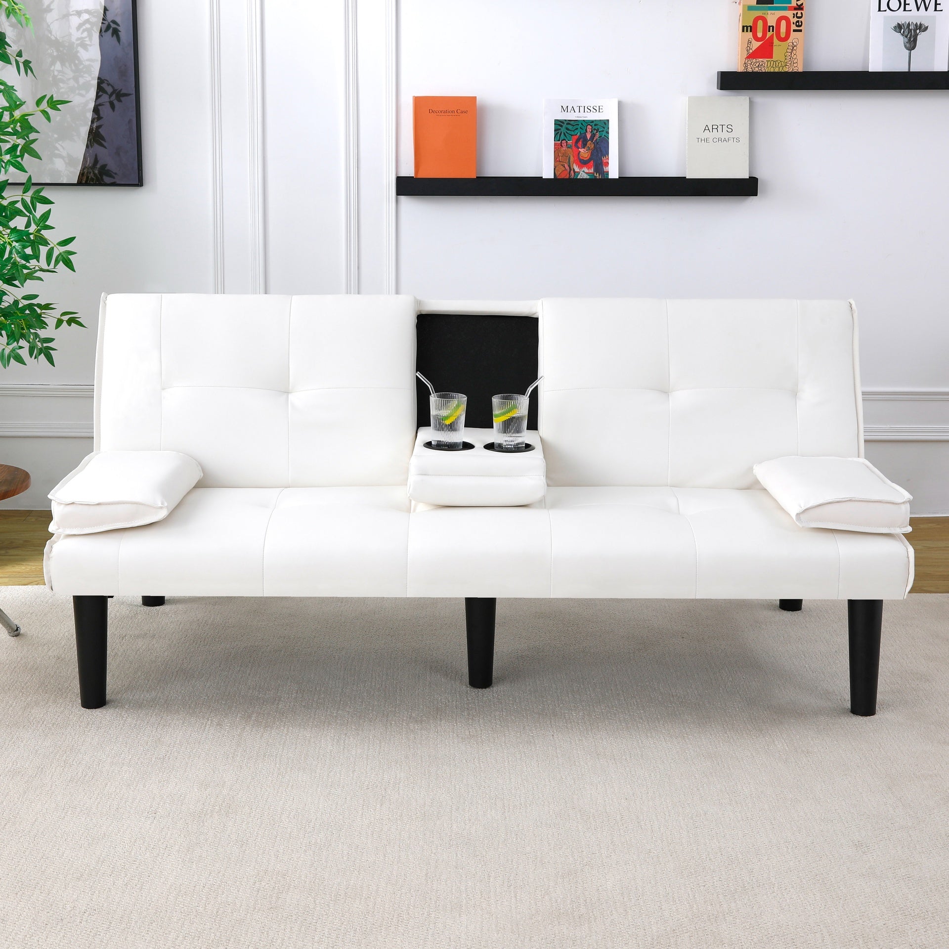 The 67-inch white PVC multi-functional sofa bed, with a foldable and cup holder design, makes it extremely convenient to turn the living room into a guest room