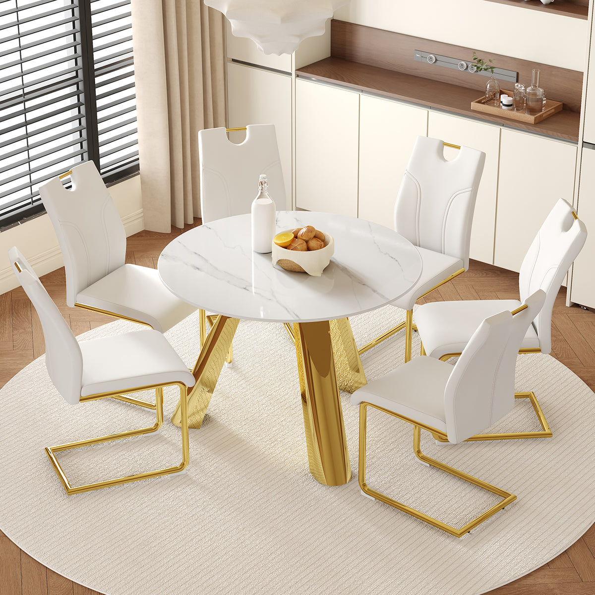 Table and chair set.A 42-inch stainless steel leg round table.Paired with 6 Uniquely designed White Dining Chairs With Golden Metal Leg.Snow Mountain White Texture Sintered Stone Tabletop.