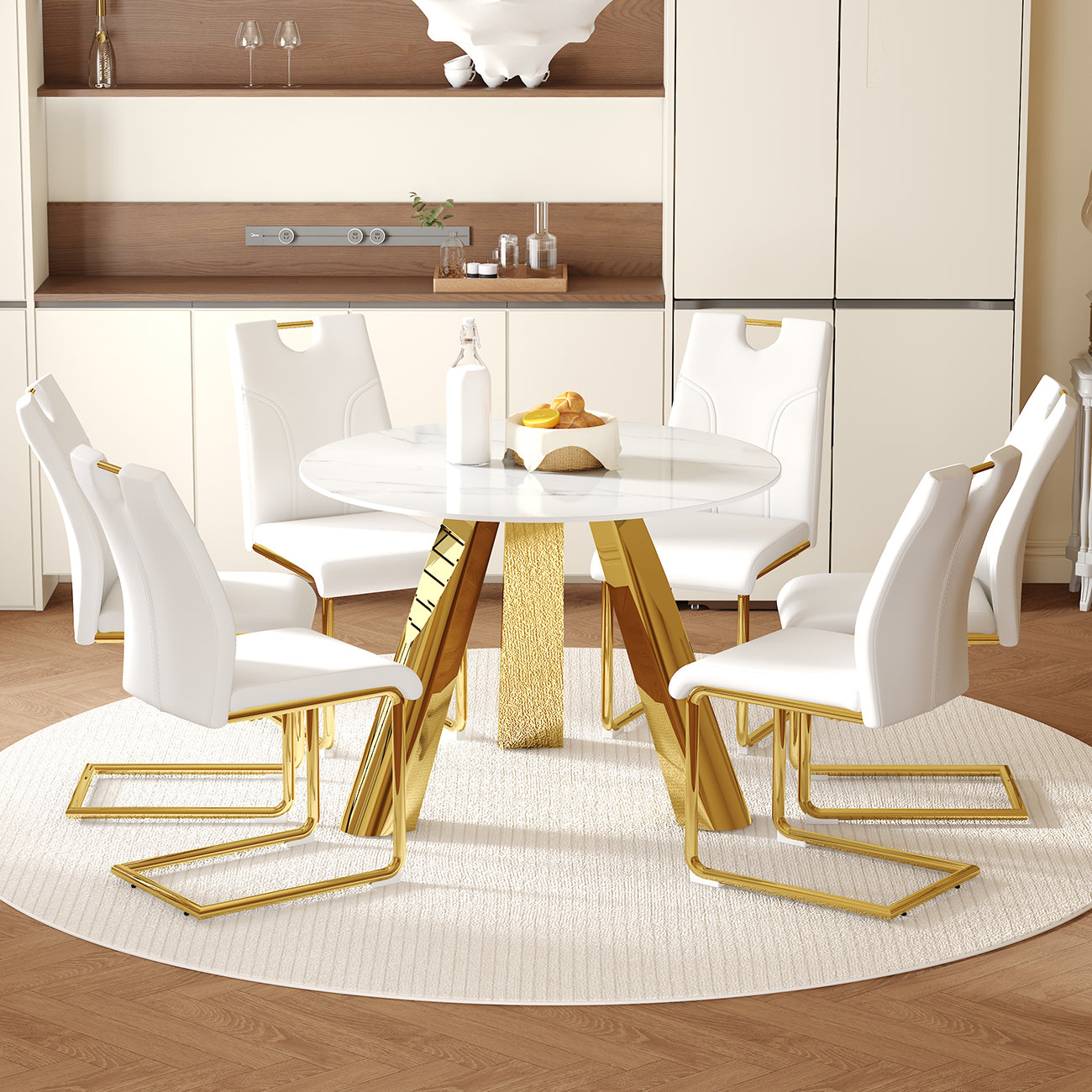Table and chair set.A 42-inch stainless steel leg round table.Paired with 6 Uniquely designed White Dining Chairs With Golden Metal Leg.Snow Mountain White Texture Sintered Stone Tabletop.