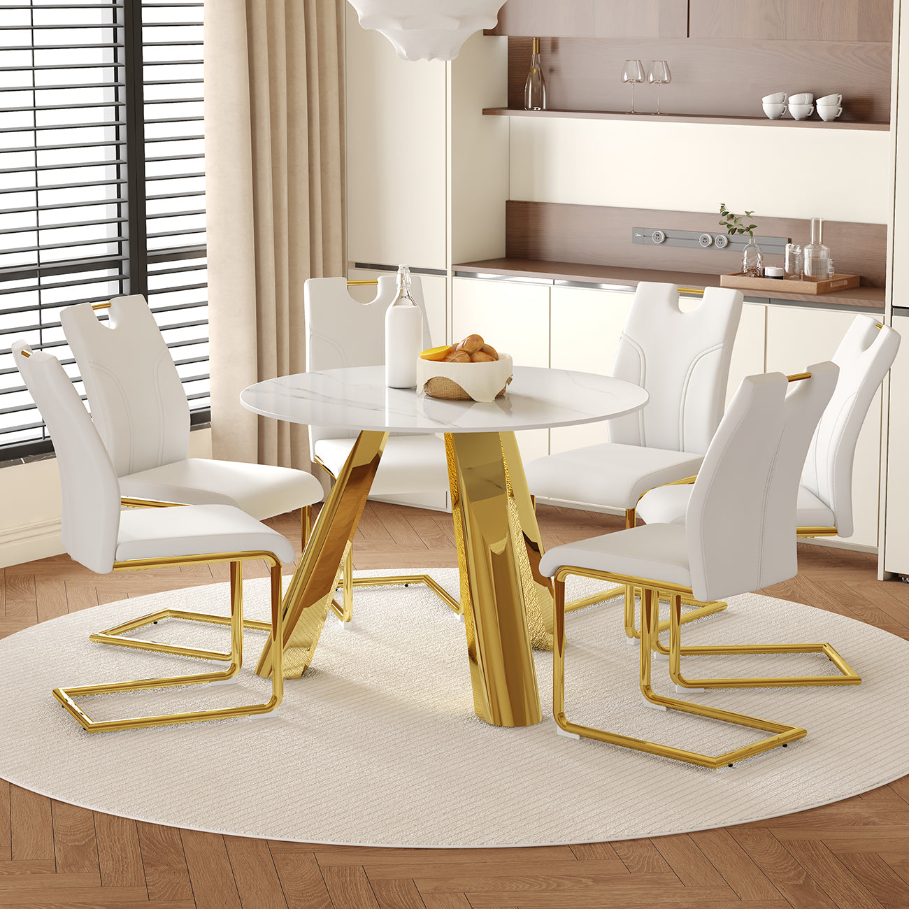 Table and chair set.A 42-inch stainless steel leg round table.Paired with 6 Uniquely designed White Dining Chairs With Golden Metal Leg.Snow Mountain White Texture Sintered Stone Tabletop.